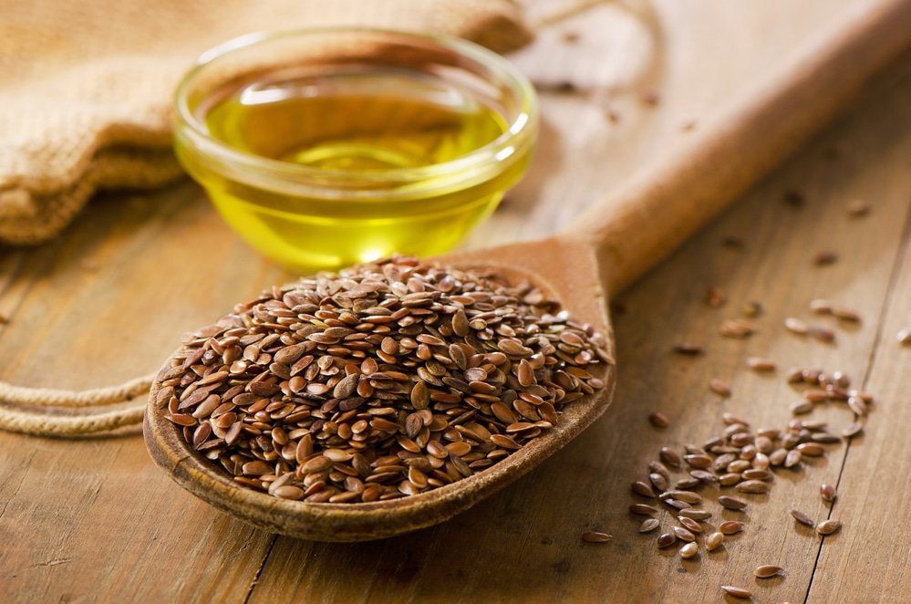 Brown flaxseeds on a spoon